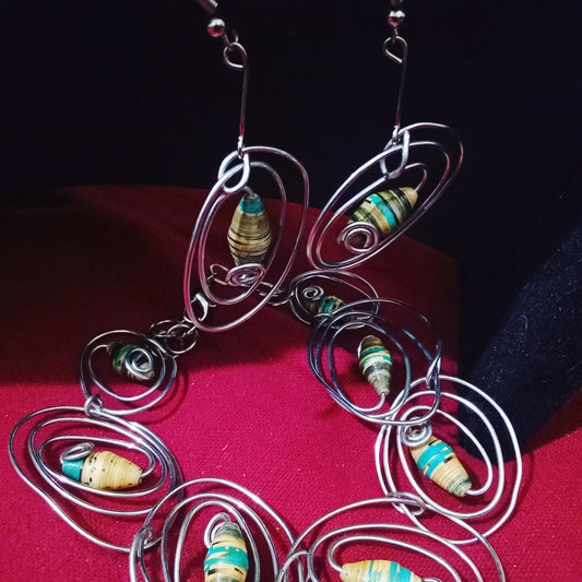 Spiral wire spiralling around multi colored beaded bracelet and earrings.