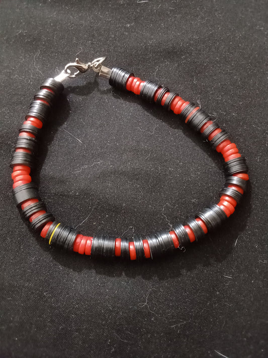 Black and red flat beads in an alternating pattern. Lobster claw clasp